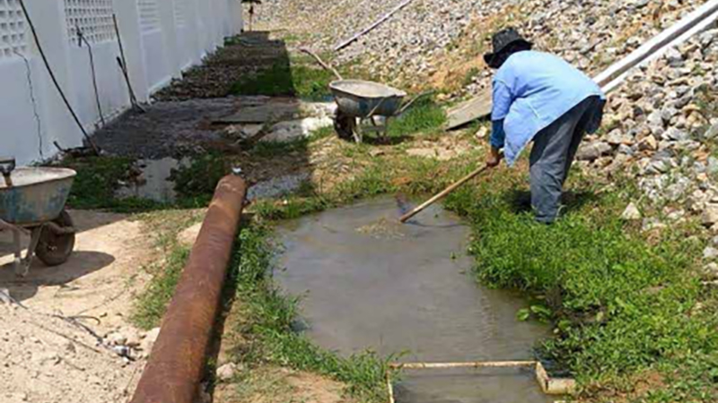 AGI Case History - Brazillian worker cleaning water from a dam leak