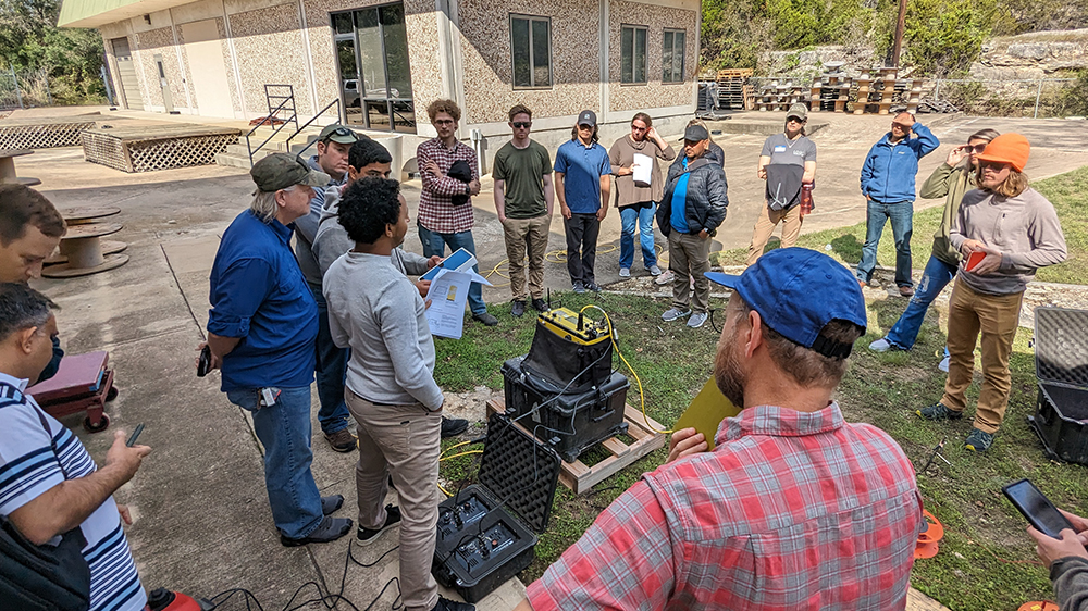 A group of people learning about electrical resistivity equipment