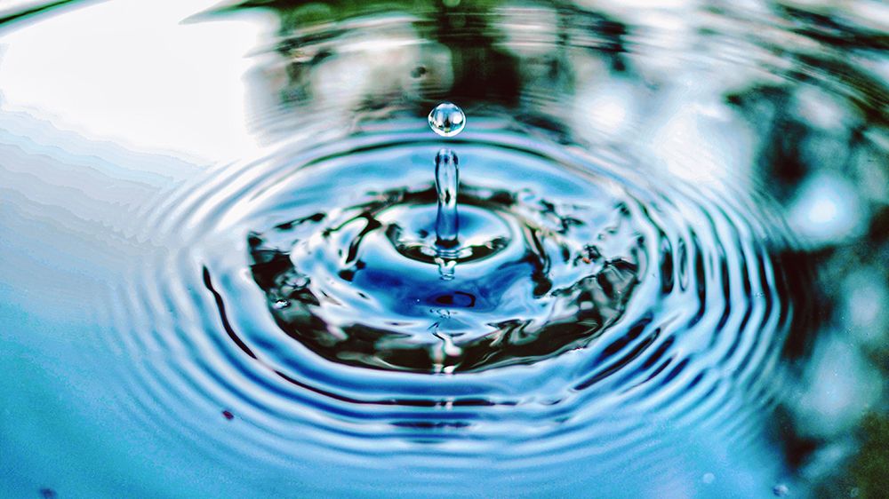 puddle of water with droplet