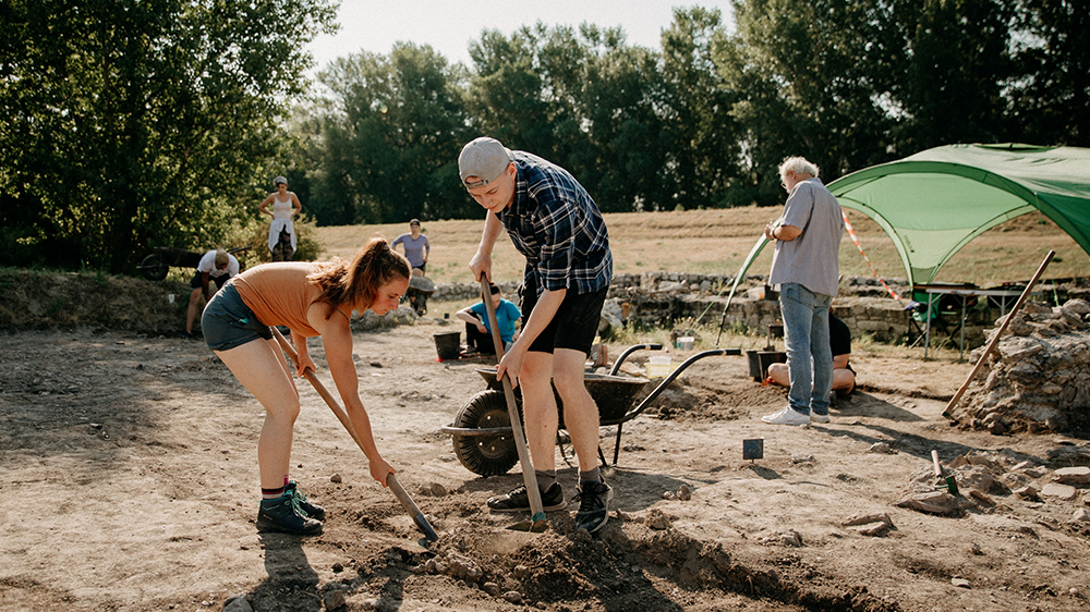 People digging at an archeology site