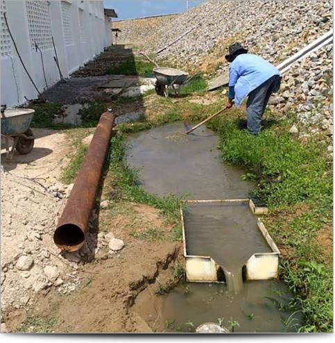 AGI Case History - Brazilian worker cleaning up dam leakage