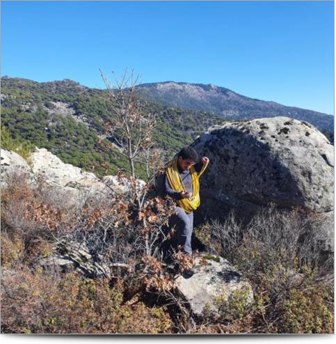 AGI Case History - Turkey Granite Mining Project - A worker carrying AGI passive electrode cables